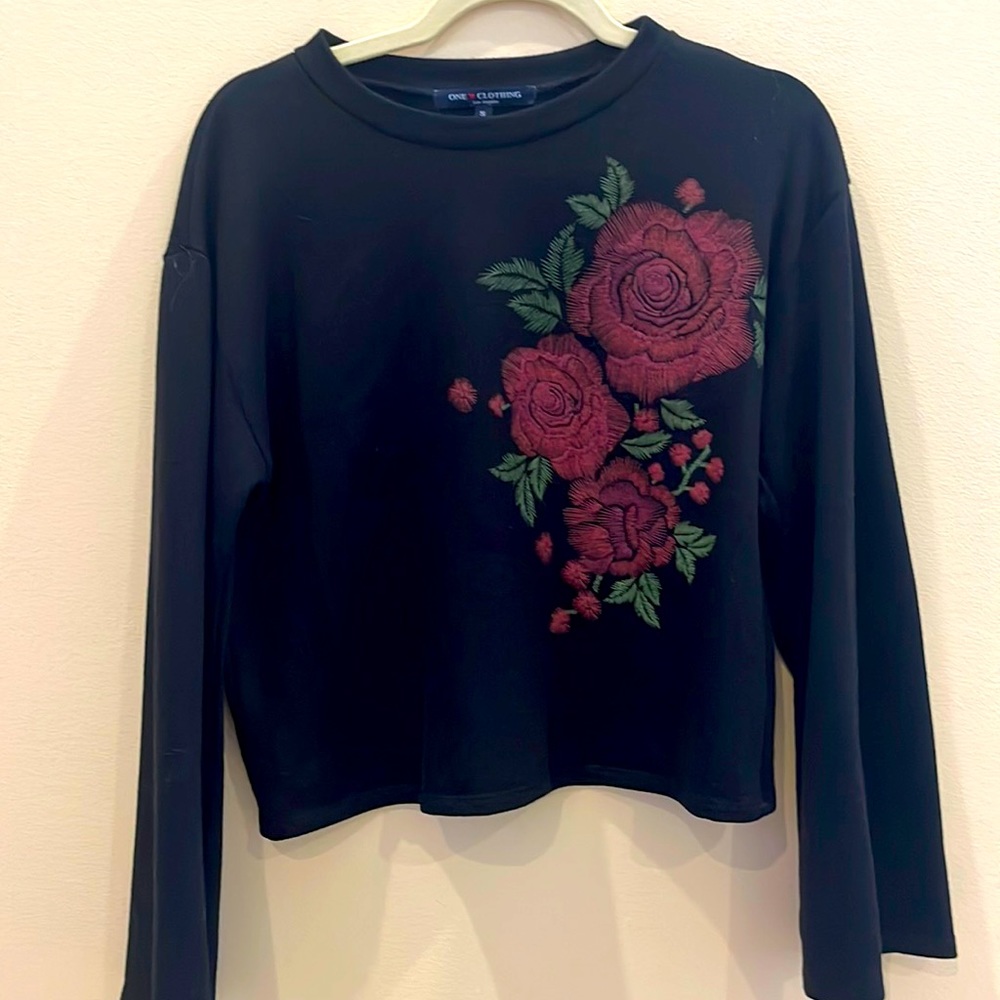 Black sweater with red roses